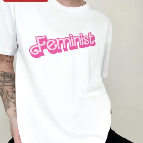 Close-up of Feminist Tee Retro Y2K Pink Typography Statement Shirt for Women for streetwear fans in Chicago, Illinois