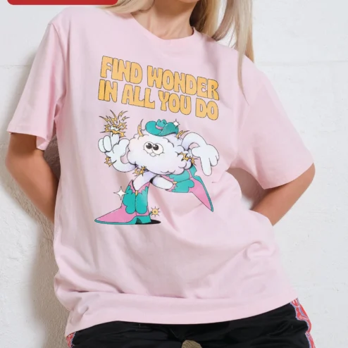 Find Wonder In All You Do Whimsical Cowboy Cloud Graphic Tee on a hanger, ready to ship from Chicago, Illinois