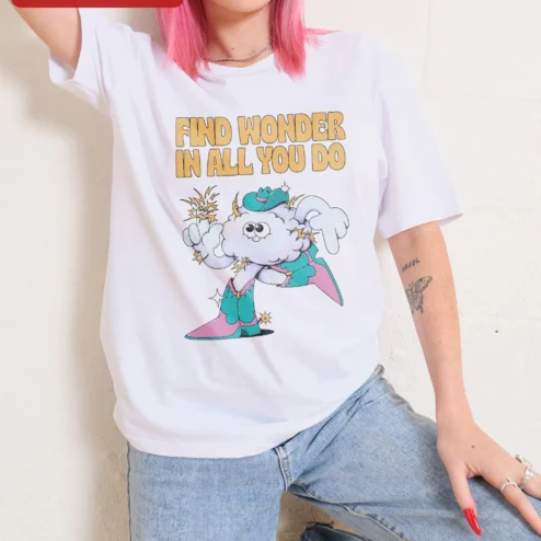Customer in Chicago, Illinois wearing Find Wonder In All You Do Whimsical Cowboy Cloud Graphic Tee