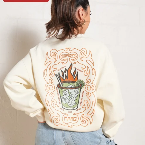 Close-up of Flaming Cocktail Spicy Marg Sweatshirt Oversized Cream Pullover with Small Left Chest Graphic for Wo for streetwear fans in Chicago, Illinois