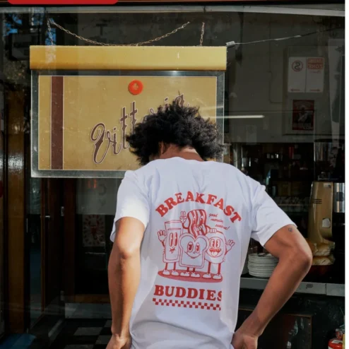 Customer in Chicago, Illinois wearing Good Morning Sunshine Ringer Tee Cute Breakfast Cartoon Graphic Shirt for Women
