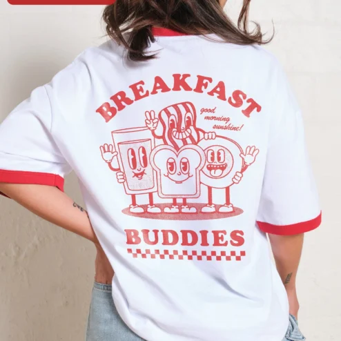 Customer in Chicago, Illinois wearing Good Morning Sunshine Ringer Tee Cute Breakfast Cartoon Graphic Shirt for Women