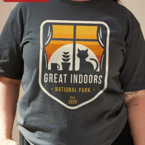 Customer in Chicago, Illinois wearing Great Indoors National Park Cat Lover Vintage Badge Tee for Introverts Homebodies