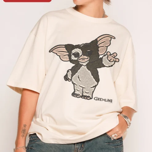 Customer in Chicago, Illinois wearing Gremlins Gizmo Wave Oversized Tee Retro 1984 Horror Movie Merch Gift for Men Women