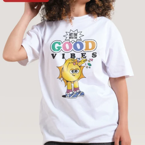 Hit Em With The Good Vibes Retro Cartoon Sun Graphic Tee on a hanger, ready to ship from Chicago, Illinois