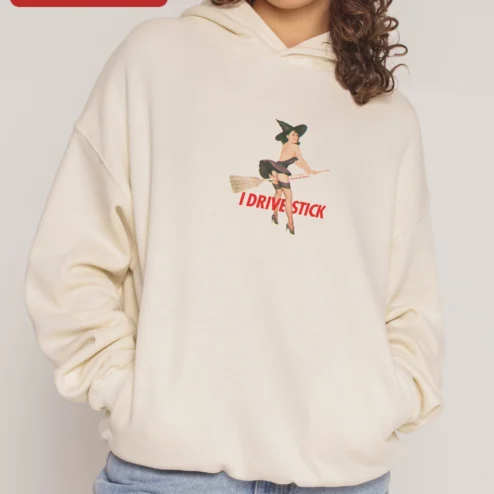Customer in Chicago, Illinois wearing I Drive Stick Hoodie Funny Witch Broomstick Graphic Pullover Gift for Women Men Car Enthusiasts