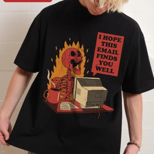 I Hope This Email Finds You Well Funny Corporate Burnout Skeleton Graphic Tee on a hanger, ready to ship from Chicago, Illinois
