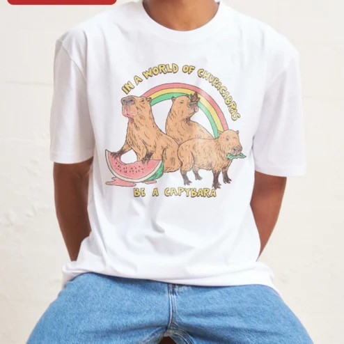 In A World Of Chupacabras Be A Capybara Funny Animal Meme Tee Retro Graphic Shirt Gift For Animal Lo on a hanger, ready to ship from Chicago, Illinois