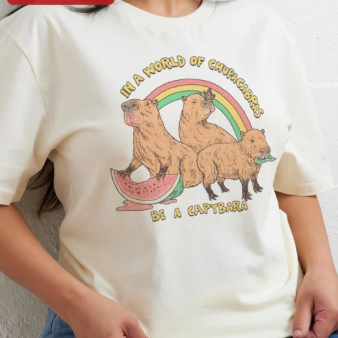 In A World Of Chupacabras Be A Capybara Funny Animal Meme Tee Retro Graphic Shirt Gift For Animal Lovers