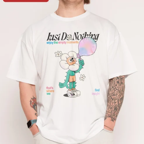Just Do Nothing Enjoy The Empty Moments Tee Anti Hustle Culture Slow Living Graphic T-Shirt on a hanger, ready to ship from Chicago, Illinois