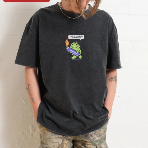 Let's Commit Arson Frog Graphic Tee Funny Dark Humor Novelty Shirt on a hanger, ready to ship from Chicago, Illinois