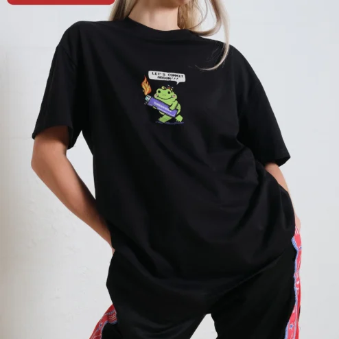 Customer in Chicago, Illinois wearing Let's Commit Arson Funny Frog Graphic Tee Unisex Dark Humor Kawaii Shirt