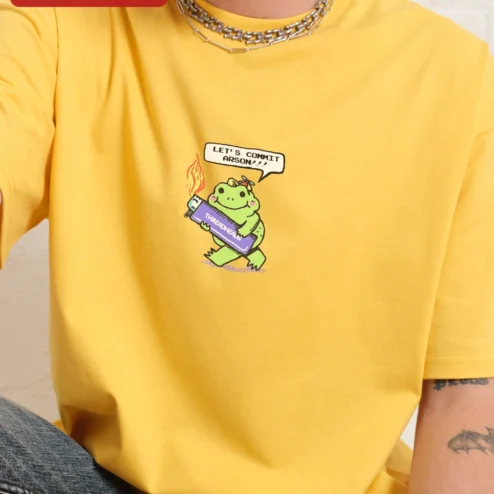 Customer in Chicago, Illinois wearing Let's Commit Arson Funny Frog Graphic Tee Unisex Dark Humor Kawaii Shirt