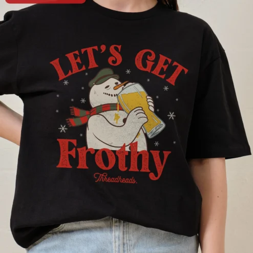 Let's Get Frothy Tee Funny Christmas Snowman Drinking Beer Graphic T-Shirt Holiday Party Gift on a hanger, ready to ship from Chicago, Illinois