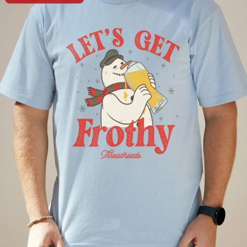 Close-up of Let's Get Frothy Tee Funny Christmas Snowman Drinking Beer Graphic T-Shirt Holiday Party Gift for streetwear fans in Chicago, Illinois