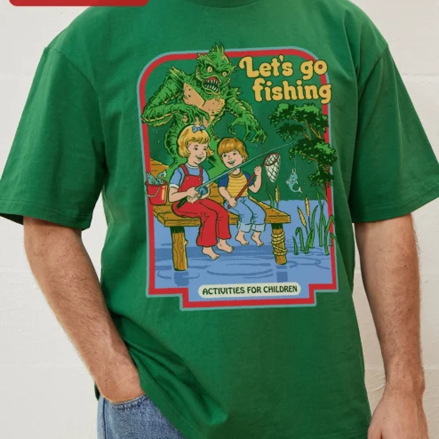 Let's Go Fishing Activities For Children Tee Vintage Horror Swamp Monster Graphic Shirt on a hanger, ready to ship from Chicago, Illinois