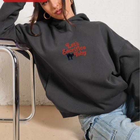 Customer in Chicago, Illinois wearing Let's Sacrifice Toby Hoodie Steven Rhodes Retro Occult Graphic Pullover Funny Cat Gift