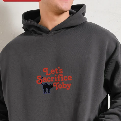 Customer in Chicago, Illinois wearing Let's Sacrifice Toby Hoodie Steven Rhodes Retro Occult Graphic Pullover Funny Cat Gift