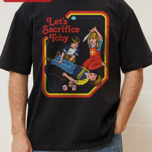 Customer in Chicago, Illinois wearing Let's Sacrifice Toby Tee Steven Rhodes Retro Dark Humor Graphic T-Shirt Unisex Cotton Gift