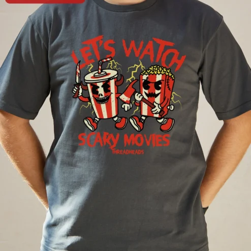 Let's Watch Scary Movies Vintage Horror Snack Monsters Graphic Tee for Halloween Fans on a hanger, ready to ship from Chicago, Illinois