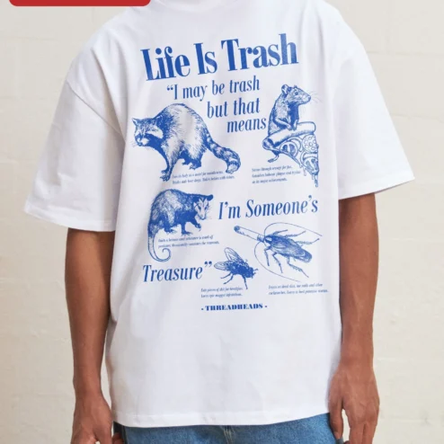 Life Is Trash I May Be Trash But That Means Im Someone's Treasure Tee on a hanger, ready to ship from Chicago, Illinois