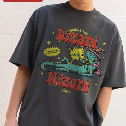 Lizard Wizard Tee Behold The Lizard Wizard Cold-Blooded Magic Reptile Graphic Shirt for Fantasy Fans on a hanger, ready to ship from Chicago, Illinois