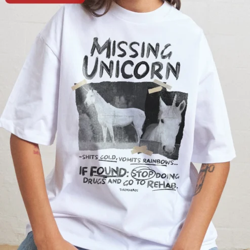 Missing Unicorn Shits Gold Vomits Rainbows Funny Graphic Tee Gag Gift Shirt on a hanger, ready to ship from Chicago, Illinois