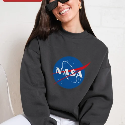 Customer in Chicago, Illinois wearing NASA Meatball Logo Vintage Crewneck Sweatshirt for Men and Women Space Enthusiasts