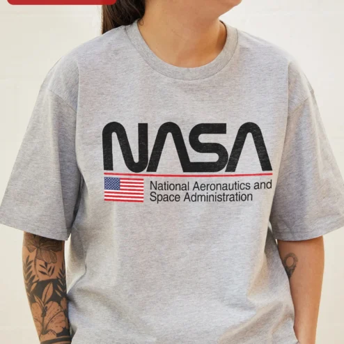 NASA Worm Logo Tee National Aeronautics and Space Administration Retro Graphic Shirt for Science Lov on a hanger, ready to ship from Chicago, Illinois