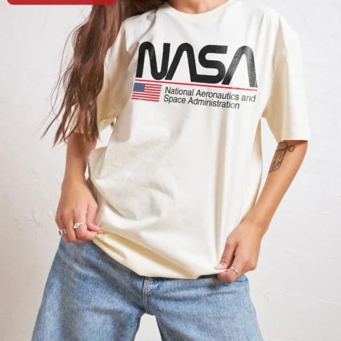 Customer in Chicago, Illinois wearing NASA Worm Logo Tee National Aeronautics and Space Administration Retro Graphic Shirt for Science Lov