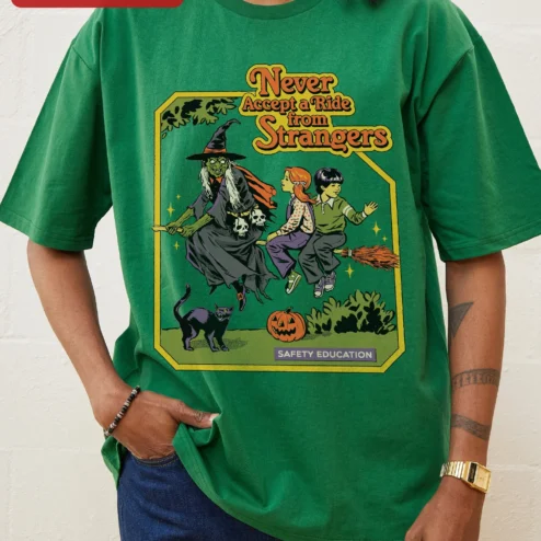 Never Accept a Ride from Strangers Safety Education Vintage Horror Witch Halloween Graphic Tee on a hanger, ready to ship from Chicago, Illinois