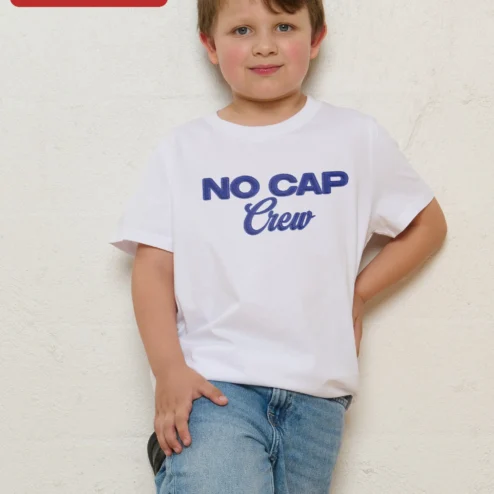 Close-up of NO CAP Crew Kids Tee Black Embroidered Streetwear Shirt for Girls Gen Alpha Slang Apparel for streetwear fans in Chicago, Illinois