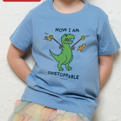 Close-up of Now I Am Unstoppable Dinosaur Kids Tee Funny T-Rex Graphic Shirt for Boys Girls for streetwear fans in Chicago, Illinois
