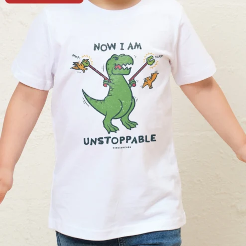 Customer in Chicago, Illinois wearing Now I Am Unstoppable Dinosaur Kids Tee Funny T-Rex Graphic Shirt for Boys Girls