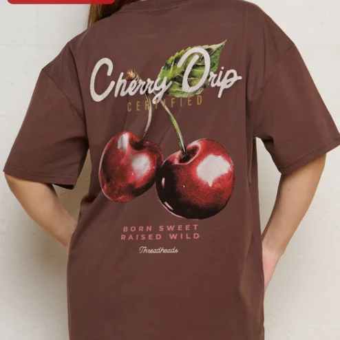 Customer in Chicago, Illinois wearing Oversized Cherry Graphic Tee Men Minimalist Streetwear Dark Grey Cotton T-Shirt