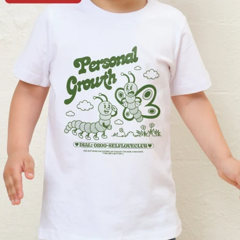 Customer in Chicago, Illinois wearing Personal Growth Caterpillar Butterfly Quote Tee Self Love Club Toddler Shirt