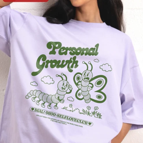 Personal Growth Caterpillar Butterfly Quote Tee Self Love Club Vintage Cartoon Graphic Shirt on a hanger, ready to ship from Chicago, Illinois