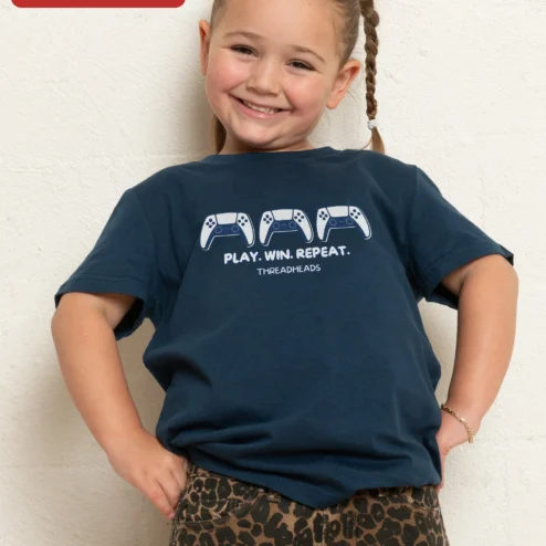 Play Win Repeat Gaming Tee Kids Video Game Controller Shirt Gift for Boys Gamers on a hanger, ready to ship from Chicago, Illinois