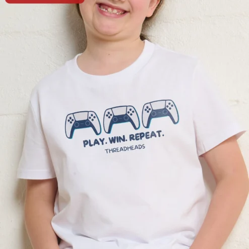 Customer in Chicago, Illinois wearing Play Win Repeat Gaming Tee Kids Video Game Controller Shirt Gift for Boys Gamers