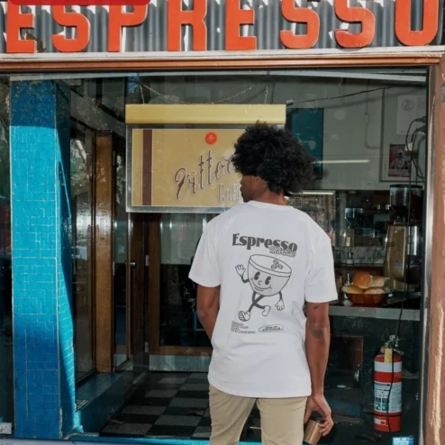 Customer in Chicago, Illinois wearing Retro Coffee Cup Mascot Tee Vintage Cartoon Graphic Shirt for Coffee Lovers and Baristas