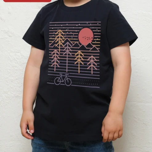 Retro Sunset Bicycle Pine Trees Kids Tee Vintage Synthwave Bike Graphic Shirt for Young Cyclists on a hanger, ready to ship from Chicago, Illinois
