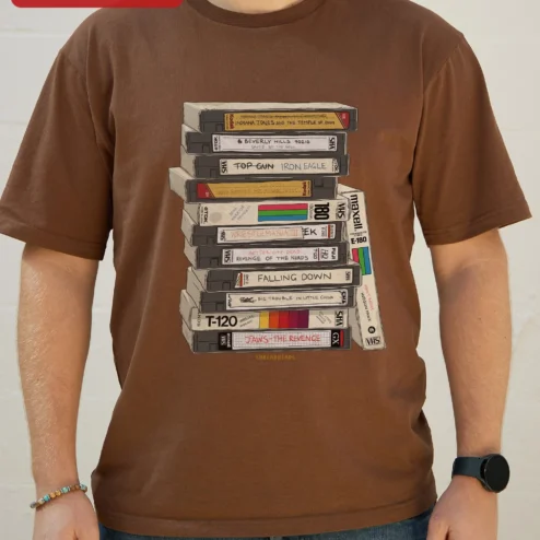 Close-up of Retro VHS Tapes Stack Graphic Tee 80s Nostalgia Vintage Video Cassette Shirt for Movie Buffs for streetwear fans in Chicago, Illinois