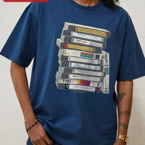Customer in Chicago, Illinois wearing Retro VHS Tapes Stack Graphic Tee 80s Nostalgia Vintage Video Cassette Shirt for Movie Buffs