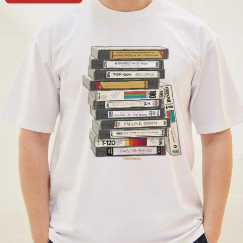 Close-up of Retro VHS Tapes Stack Graphic Tee 80s Nostalgia Vintage Video Cassette Shirt for Movie Buffs for streetwear fans in Chicago, Illinois