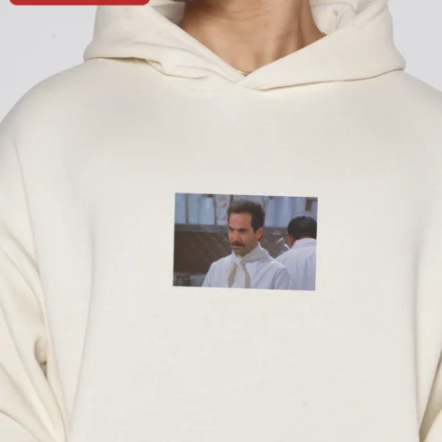 Close-up of Sacha Baron Cohen Hoodie Borat Ali G Comedy Fan Merch Black Pullover for streetwear fans in Chicago, Illinois