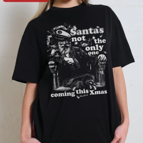 Santa's Not The Only One Coming This Xmas Funny Adult Christmas Tee Vintage Rock Holiday Party Gift on a hanger, ready to ship from Chicago, Illinois