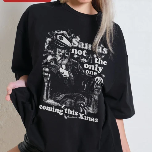 Santa's Not The Only One Coming This Xmas Funny Christmas Tee Edgy Grunge Holiday Gift on a hanger, ready to ship from Chicago, Illinois