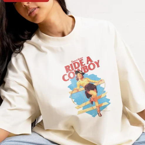 Close-up of Save a Horse Ride a Cowboy Graphic Tee Retro Western Pin Up Cowgirl Shirt Funny Country Gift for Wom for streetwear fans in Chicago, Illinois
