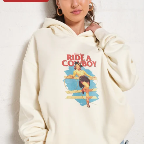 Customer in Chicago, Illinois wearing Save a Horse Ride a Cowboy Hoodie Vintage Pin Up Cowgirl Western Country Music Gift for Women