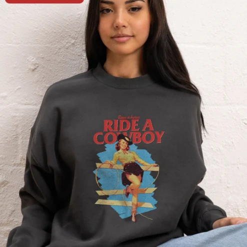 Save a Horse Ride a Cowboy Sweatshirt Western Pin Up Cowgirl Graphic Crewneck for Women on a hanger, ready to ship from Chicago, Illinois